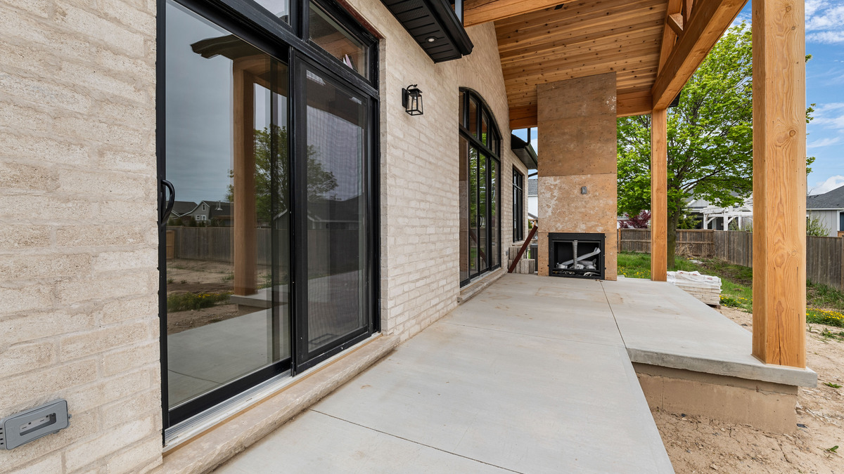 covered back deck with outdoor fireplace thumbnail